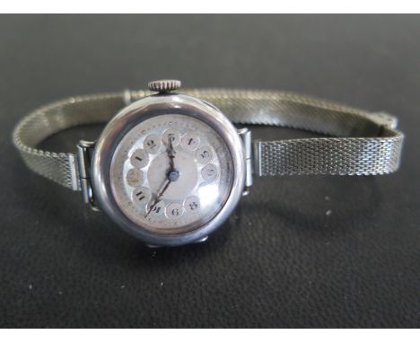 A manual wind ladies wristwatch on a plated strap - Width 27mm including button - working in the saleroom, some usage marks 
