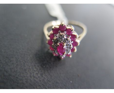 A 9ct yellow gold ruby and diamond cluster ring size N - approx weight 2.3 grams - some light surface scratches 