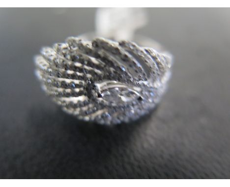 An 18ct white gold diamond feather ring - approx diamond weight 1.12ct - ring size M - approx weight 5.4 grams - ex jewellers