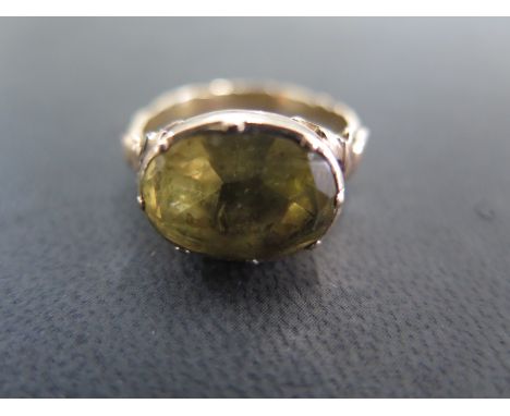 A presumed 18ct yellow gold oval cut citrine Georgian ring - the citrine being 14.6mm x 11.2mm x approx 6mm deep - some light