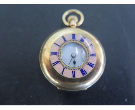 An 18ct yellow gold half Hunter ladies pocket watch, Roman numerals to white enamel dial subsidiary seconds at 6 o'clock - to