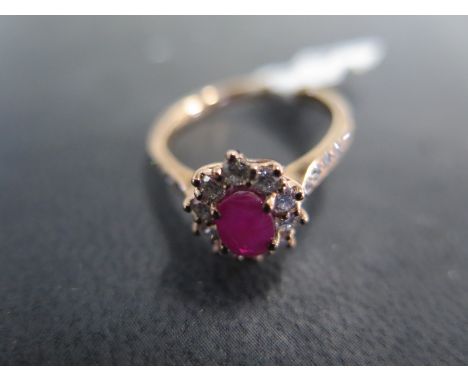 A 9ct yellow gold ruby and diamond ring size M - approx weight 2.2 grams - ex jewellers stock, in new unused condition, retai