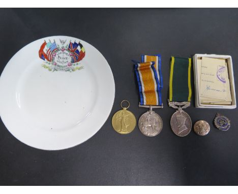 A World War One 1914-18 Medal, A WWI Victory Medal and a Territorial Army Efficiency Medal awarded to 180768 Pte F Stanford L