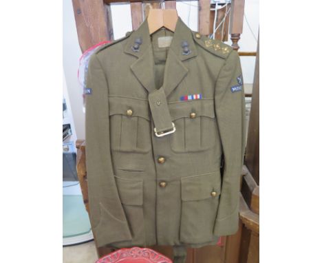 A British Army uniform WWII period Captain Stonehouse Royal Artillery, uniform to include - battle dress tunic, no. 2 jacket 