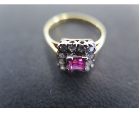 An 18ct yellow gold pink sapphire and diamond ring size L/M - approx weight 2.7 grams - the square cut pink sapphire surround