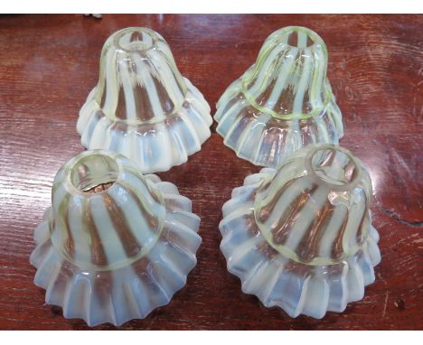 Four Vaseline glass light shades - Diameter 14cm x Height 11cm - some minor damage to inside top rim on all 