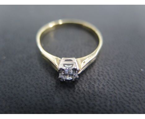 An 18ct yellow gold solitaire ring size R - approx weight 2.3 grams - total diamond weight approx 0.4ct - light surface scrat