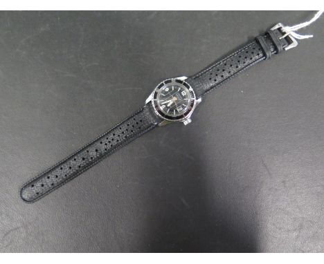 A mid sized Cardinal Submarine manual wristwatch with Arabic numerals at 12, 6 & 9, date aperture at 3 o'clock, black dial wi