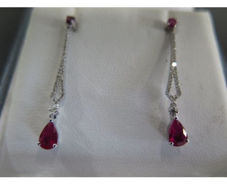 A pair of ruby and diamond drop earrings - Length 30mm - approx weight 2.55 grams - ex jewellers stock, in new unused conditi