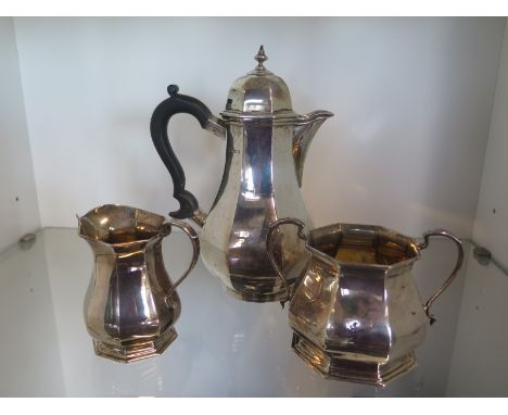 A silver coffee/water jug London 1869/70 CS & HS - approx weight 19.7 troy oz and a similar milk and sugar Sheffield 1924/25 