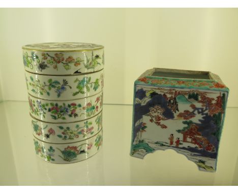 A Famille Rose four section lidded spice tower - Height 14cm - chips to three sections and damage and glued top - also with a