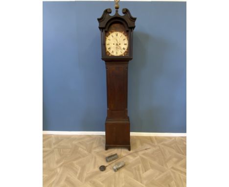 A Georgian oak longcase clock with a painted 8-day arched dial movement, with reeded quarter columns and a swan neck pediment