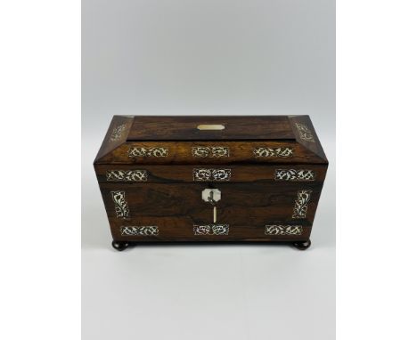 A Victorian rosewood and mother of pearl inlaid tea caddy, the interior with two lidded tea compartments and a mixing bowl, r