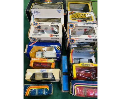 Quantity of boxed diecast model vehicles. Estimate £20-40.