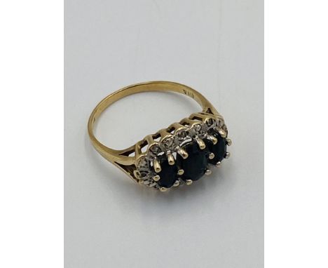 9ct gold ring set with three stones, 2.5g, size M1/2. Estimate: £40-60