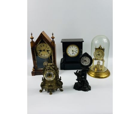A collection of five mantel clocks to include: a brass anniversary clock under a glass dome; a slate and marble clock; a stee