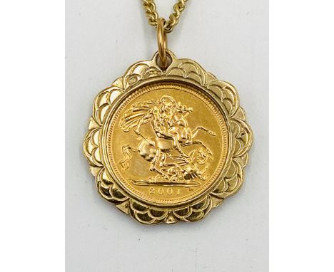 2001 gold sovereign in 9ct gold mount held on 9ct gold chain, 13.1g total. Estimate: £420-450