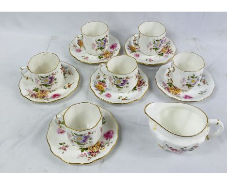 Six Royal Crown Derby coffee cups and saucers, decorated with flowers and a gilt rim; together with a Royal Crown Derby, Derb