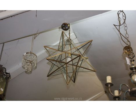 A large glass star shaped light fitting, (one section of glass cracked).