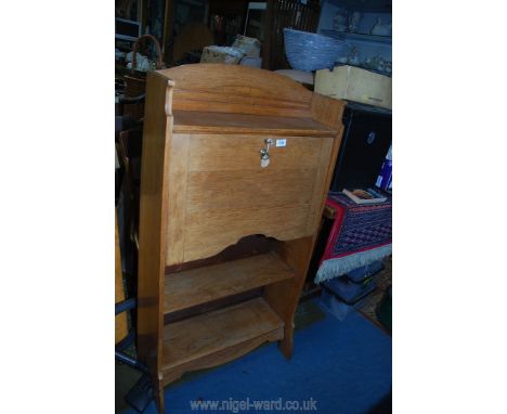 A light Oak 20th c. students bureau/bookcase, 48 3/4" high x 25 1/4" wide x 11 1/2" deep (key present).