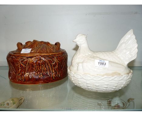 A white Portmeirion Hen on Nest and brown Portmeirion pate dish.