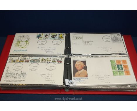 A red album of First Day Covers including horses, dogs, cycling, British flowers, NSPCC, The Duke of Edinburgh's Award etc.