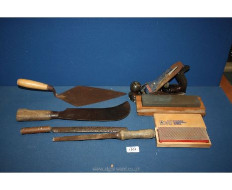 A quantity of old tools including a Stanley Bailey No. 4 plane, Bill hook, two wooden handle rasps, two sharpening stones in 