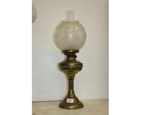 A Brass oil Lamp with chimney and shade, 23" tall.