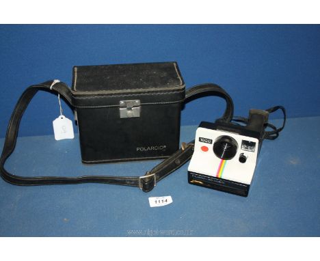 A cased Polaroid 1000 Land Camera.