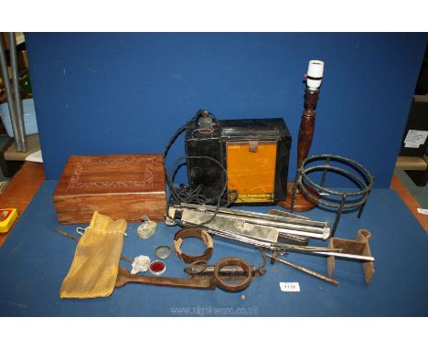 A quantity of miscellanea including music stand, vintage light box, cart wheel hub spanner, etc.
