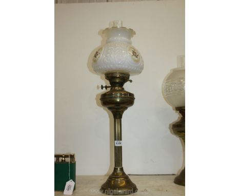 A tall Brass double burner Oil Lamp with chimney and white floral shade, approx. 29" tall overall.