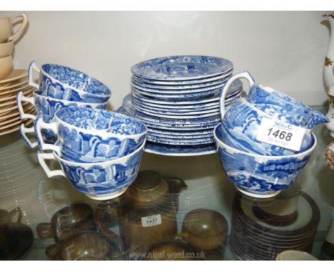 A Copeland Spode blue and white part tea set including 5 cups and saucers, 7 salad plates, cake plate, 5 side plates, jug and