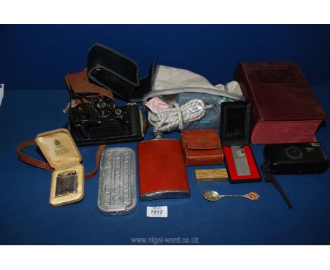 A quantity of miscellanea including Rolls razor, Nikon Zoom camera, Kodak Junior camera, Dunhill and Ronson cigarette lighter