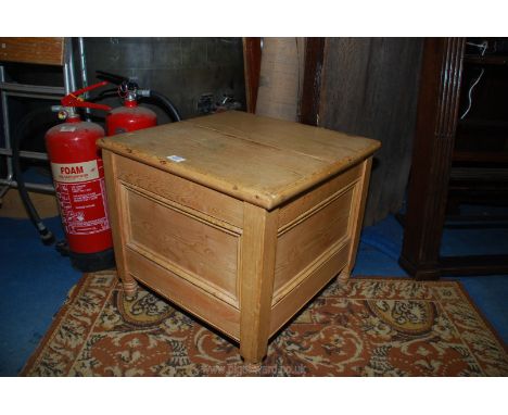 A light Pine box Commode standing on turned legs, 19 3/4" deep x 19" wide x 17 3/8" high.