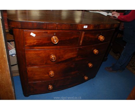 A circa 1900 Mahogany bow fronted Chest of three long and two short drawers with turned wooden knobs having mother of pearl d