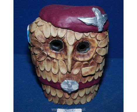 A novelty sculpture of an Owl made from clay with The Parachute Regiment beret, belt and qualification cloth wing badge and a