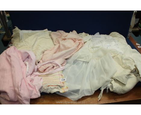 A quantity of vintage children's clothing including petticoats, dresses, bath cloaks etc, some staining.