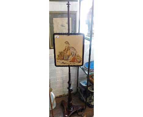 19th century rosewood pole screen with tapestry panel of two ladies in carved frame above turned column on trefoil platform b
