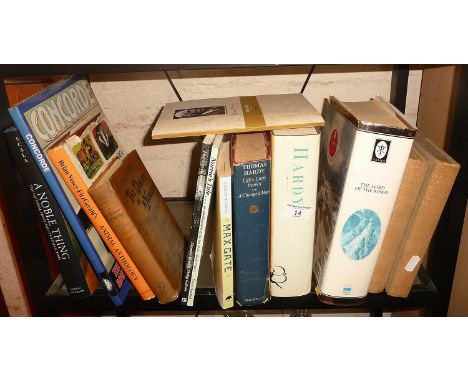 Shelf of assorted books inc. "Hardy" by Martin Seymour-Smith and "Lord of the Rings" anthology illustrated by Alan Lee, etc.