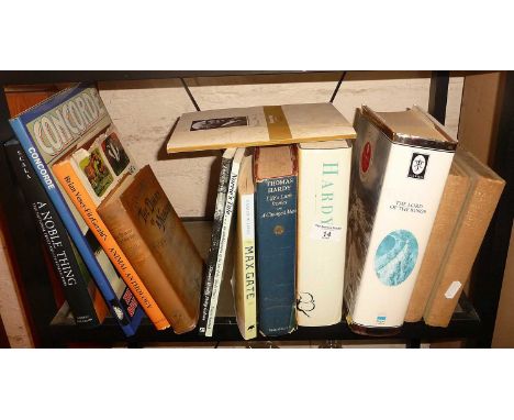 Shelf of assorted books inc. "Hardy" by Martin Seymour-Smith and "Lord of the Rings" anthology illustrated by Alan Lee, etc.