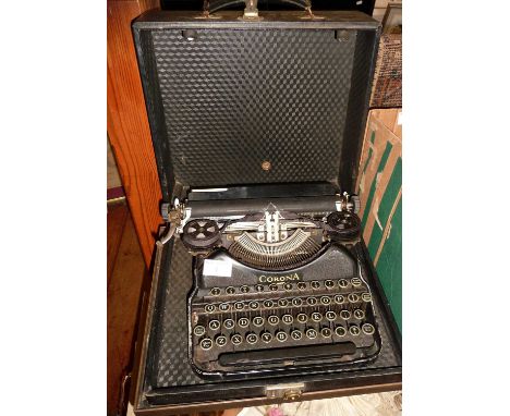 A vintage Corona portable typewriter in black enamel with case