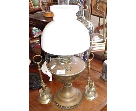 Brass oil lamp and two brass chambersticks
