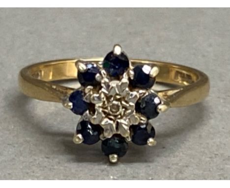 9ct yellow gold sapphire &amp; diamond cluster ring, ring comprises of 1x centre diamond surrounded by 8x sapphires, size N1/