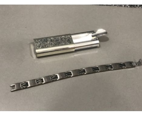 Titanium gents bracelet and designer ash tray
