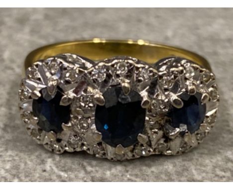 18ct sapphire &amp; diamond ring, ring comprises of 3x large sapphires surrounded by multiple diamonds, size O, 5.6g gross