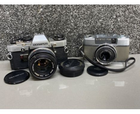 Olympus-pen camera with F=30mm lens together with Olympus OM10 camera with Olympus Zuiko auto-s 50mm lens