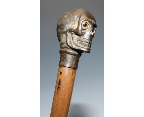 The Macabre - a novelty walking stick, the pommel as a skull, glass eyes, 94cm long overall 