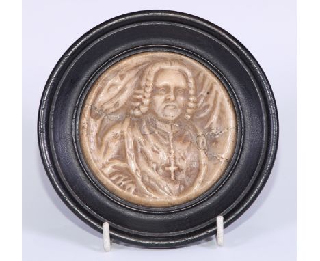 A mid-18th century Austrian Baroque alabaster bas relief portrait roundel, of Sigismund Graf von Schrattenbach, Prince-Archbi