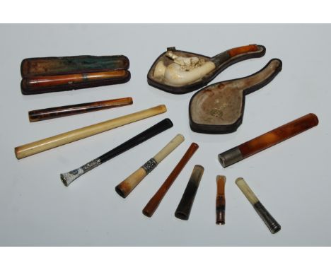A 19th century meerschaum pipe, the bowl carved with a horse, amber mouthpiece, 13cm long, c.1890, cased; cigarette and chero