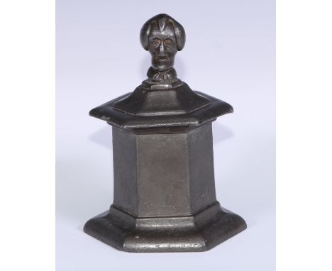 A George III lead hexagonal tobacco jar, the cover with caricature finial of Dr Syntax, after Thomas Rowlandson, spreading ba